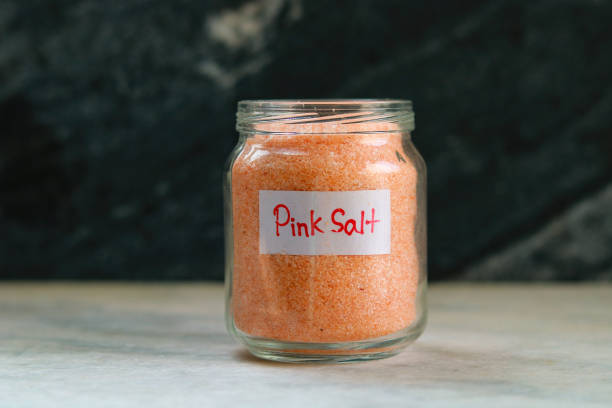 istock Pink salt in a glass jar with a label on it 2196505639