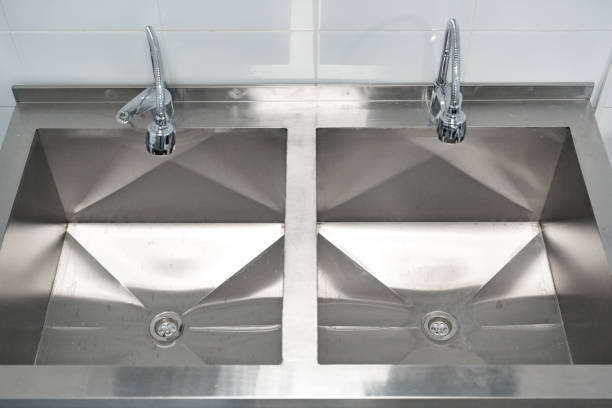 istock Stainless steel double sink in a kitchen setting with modern fixtures 2196505761