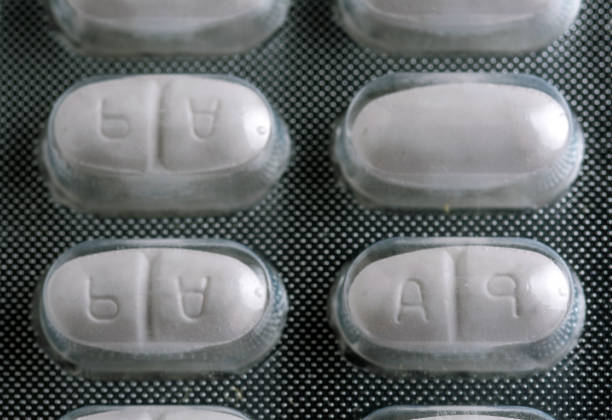 istock Close-Up of Blister Pack with White Tablets Imprinted A and 9 2196506059