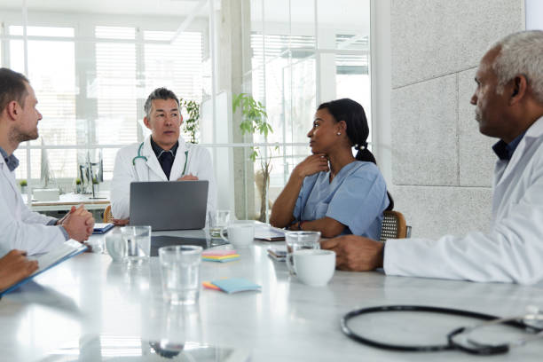 istock Group of doctors talking on a meeting in the office. 2196508811