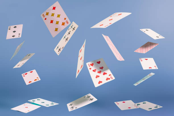istock flying playing cards on a turquoise background 2196513259