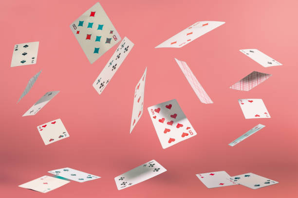 istock flying playing cards on a turquoise background 2196513277