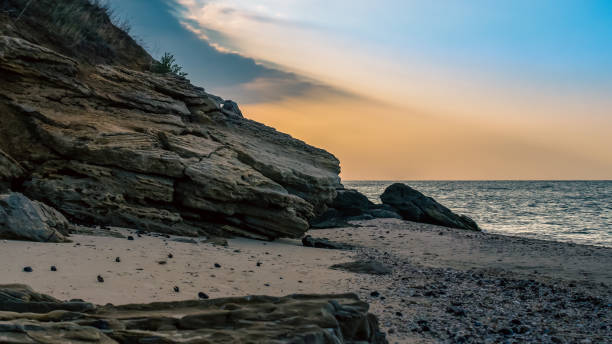 rocky seashore against the evening sky