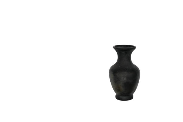 Black ceramic vase on  white background. Black clay or black pottery. Empty vase. Figurative vessel.