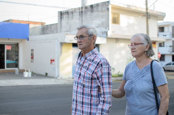 istock Senior couple strolls through the city 2196514896