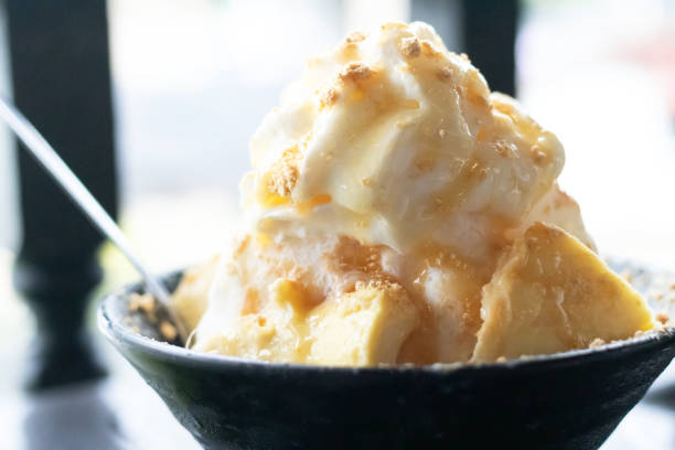 istock Delicious creamy ice cream in a black bowl Durian Bingsoo a refreshing shaved ice dessert that combines the sweet and unique flavor of durian for the perfect cool treat 2196515607