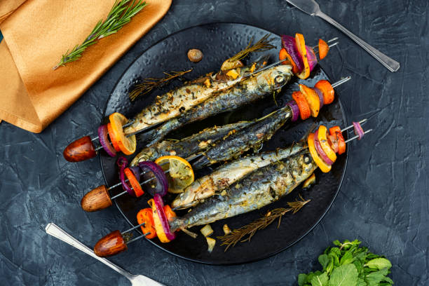 istock Fish and vegetable skewer in barbecue grill. 2196515683