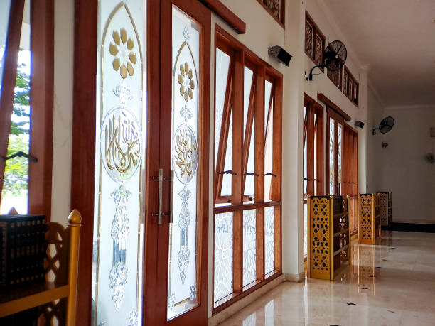 istock Interior view of a mosque with stained glass windows featuring intricate Islamic calligraphy 2196515708