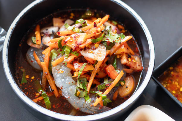 istock Thai style spicy salad with pickled shrimp in fermented fish sauce. 2196517347