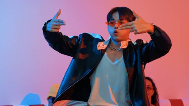 istock Attractive asian dancer perform freestyle movement with neon light. Regalement. 2196518876
