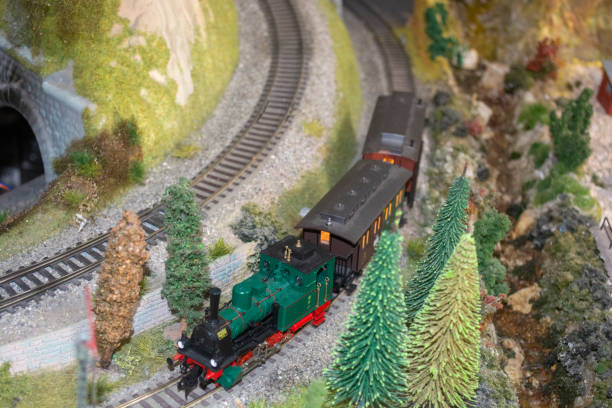 istock A toy model train eats on the rails between the Christmas trees close to the tunne 2196520090