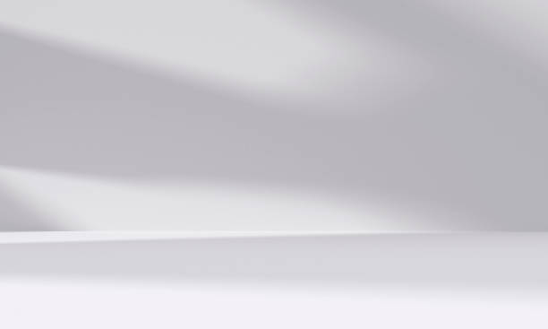 istock abstract white studio room with light and shadow from window background for product display presentation 2196521580