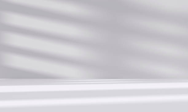 istock abstract white studio room with light and shadow from window background for product display presentation 2196521645