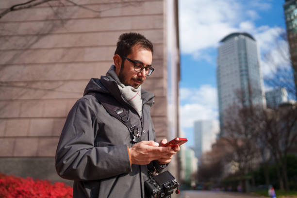 istock Freelance photographer using mobile phone in Osaka City. 2196523105