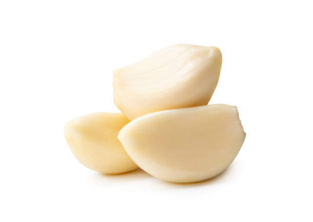 istock Side view of peeled garlic cloves or pieces in stack isolated on white background with clipping path 2196523377
