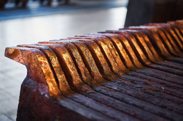 Texture of copper anode ingots detail in old metal melting workshop at powerful production industrial complex extreme close view