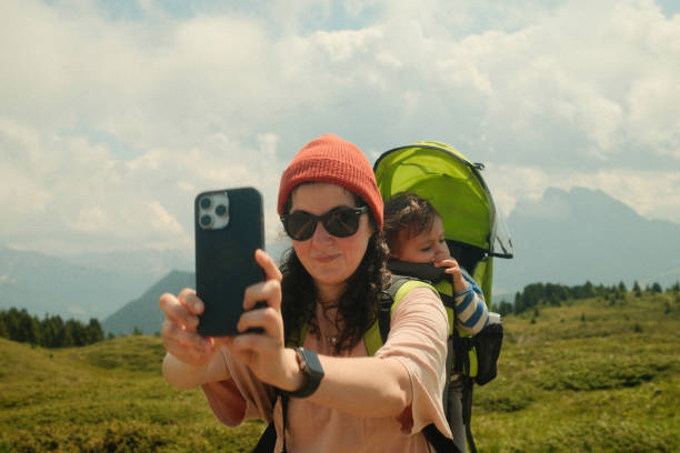 istock Mother taking selfie while hiking with baby in carrier 2196526364