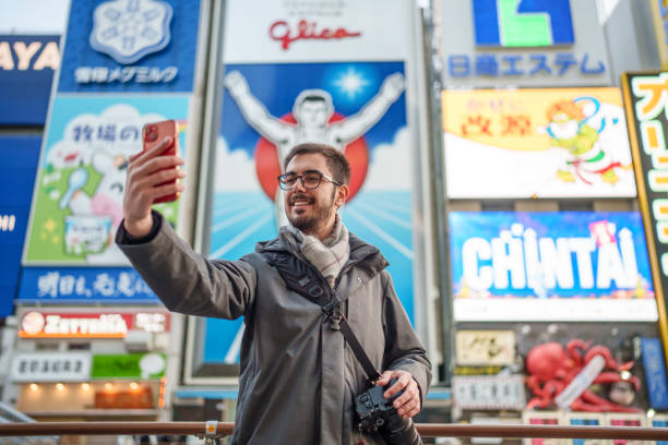 istock Man photographing with mobile phone in Dotonbori Osaka. 2196527699