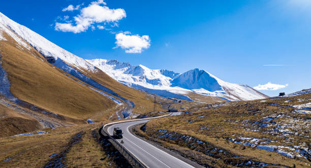istock Aerial view  on the road surrounded by winter Landscape view 2196527785