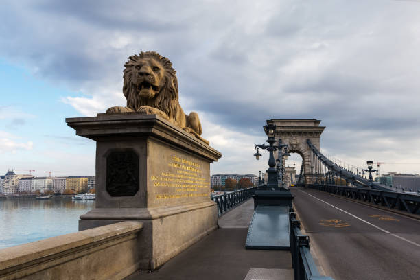 Suspension Szechenyi Chain Bridge of the 19th century over the River Danube, Budapest. View from the western side in autumn overcast morning