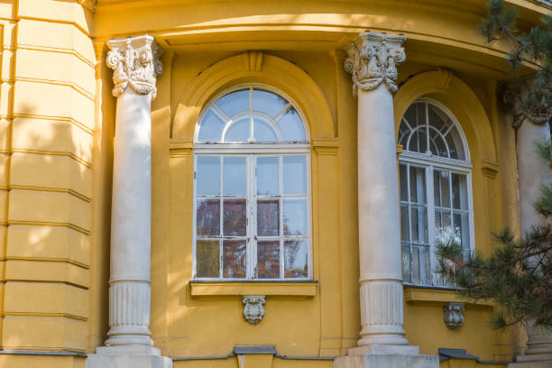 istock Arched windows in facade of baroque building with yellow wall 2196530121