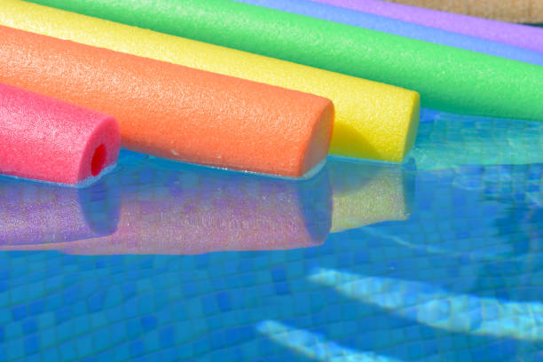 istock Swimming pool with colourful pool noodles 2196530156
