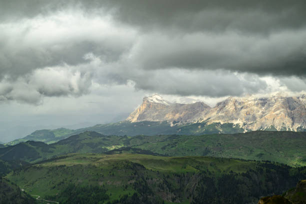 View towards the Alta Badia mountain alm from the the Viel dal Pan hiking path over the Padon chain in the Dolomites during springtime.