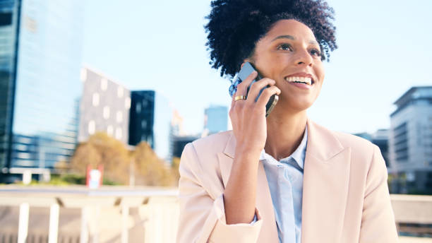 istock Smiling Businesswoman Talking On Phone Outdoors in Office District 2196531551