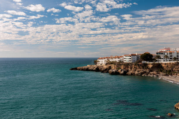 Scenic view of a coastal town with buildings on rocky cliffs