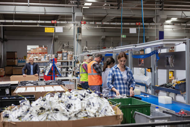 istock Manuel workers team work on production line with screw tool at factory 2196535395