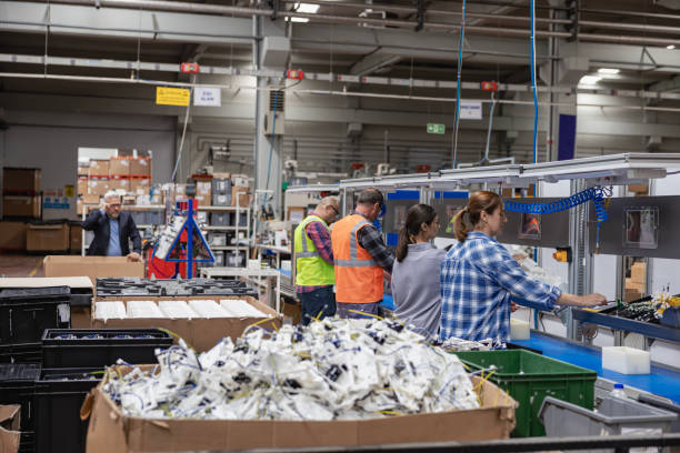 istock Manuel workers team work on production line with screw tool at factory 2196535539