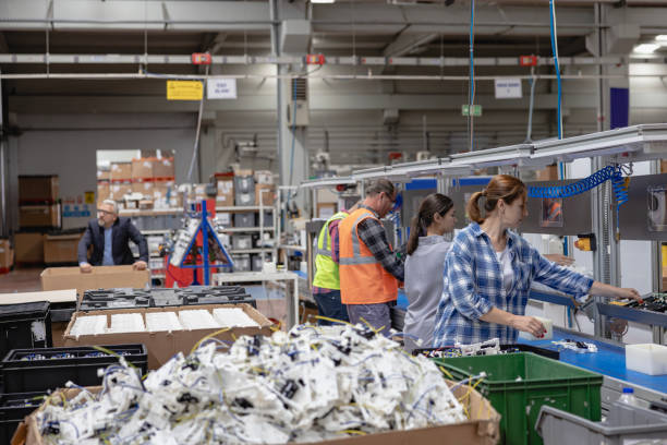 istock Manuel workers team work on production line with screw tool at factory 2196537006