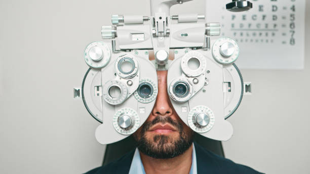 istock Portrait of a Patient Undergoing Vision Test with Optometric Equipment 2196538328