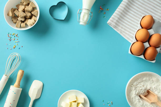 istock Frame of baking ingredients and tools on a blue background. Flat lay, top view, copy space 2196540067