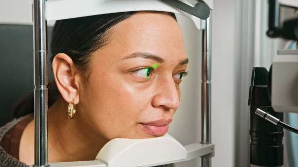 istock Young Woman Undergoing an Eye Exam at an Optometrist with Advanced Equipment 2196540107