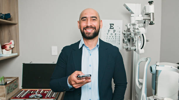 istock Professional Optometrist Smiling Confidently in an Eye Examination Room During Work 2196540701