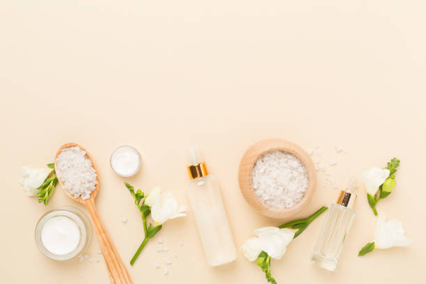 istock Flat lay with spa products and flowers on color background 2196541826