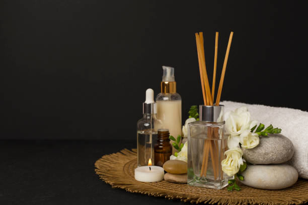 istock Spa composition with freesia flower and aroma diffuser on concrete background 2196541832