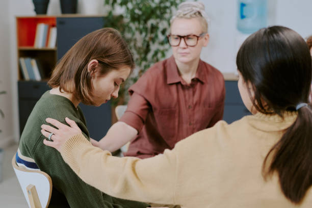 istock Supporting Young Woman During Counseling Session 2196542541