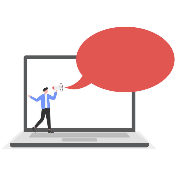 istock Hand holds a megaphone from screen of computer on a blue background. Concept of hiring, advertising, attention 2196543378