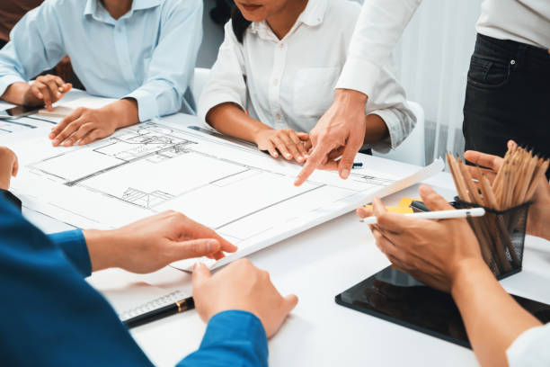 istock Diverse group of civil engineer and client working on architect. Prudent 2196544956