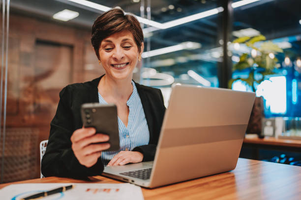 istock Business woman using smartphone 2196545514
