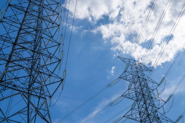 istock High voltage electric transmission tower with power lines against the sky, highlighting electricity supply, industrial infrastructure, energy distribution, and the challenges of the energy crisis. 2196547177