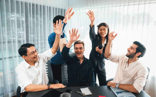 istock Group of diverse office worker join hand together in office. Prudent 2196548846