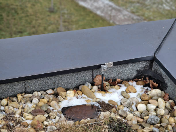 istock lightning conductor is used to protect buildings from lightning that can damage electrical equipment is routed to the highest points of a green garden roof. screwed to the edge of attic, control box 2196551396