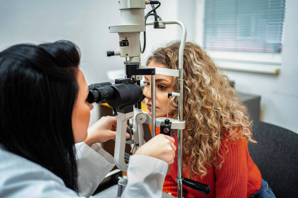 istock Optician conducting eye examination with equipment 2196552270