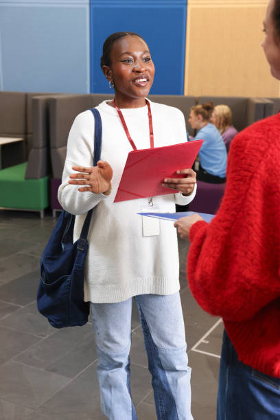 istock Smiling women talking in community center 2196555903
