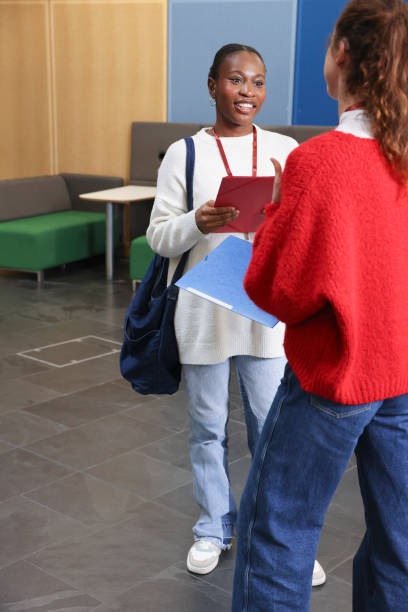 istock Smiling women talking in community center 2196555919