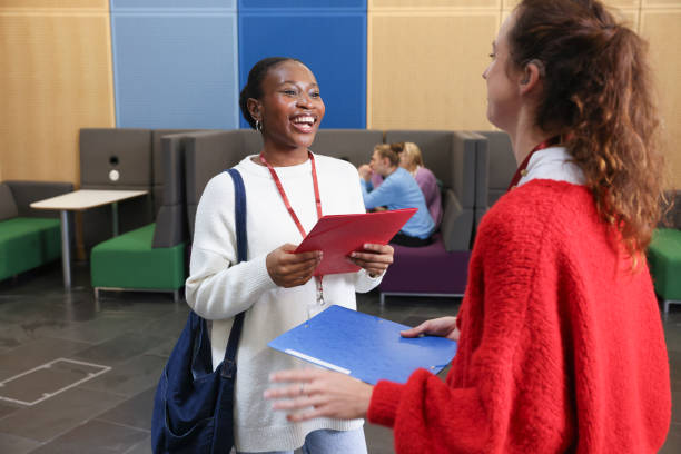 istock Smiling women talking in community center 2196555954