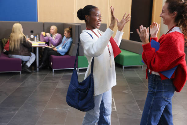 istock Smiling women talking in community center 2196555993